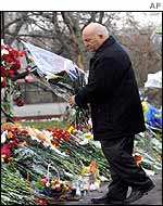 Yuri Luzhkov deposits flowers outside the theatre on Monday