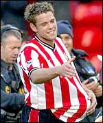 James Beattie claims the match ball after his hat-trick against Fulham