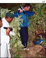Police inspect the body of a man who went on a shooting spree before killing himself 