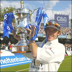 Man-of-the-match, Gloucestershire's Ian Harvey, holds aloft the C&G Trophy