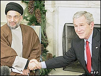 अब्दुल अज़ीज़ अल हकीम और जॉर्ज बुश